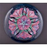 A Moorcroft Morning Glory plate 1996, signed and numbered 427/500 to base, in its original box