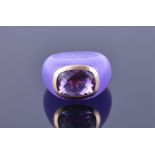 An unusual purple jade and amethyst ring the mount of purple jade, set with a faceted amethyst