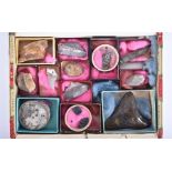 A box of assorted fossils to include nine teeth and tooth plates, a vertabra, scales and a piece