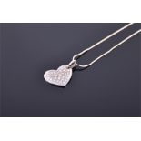 An 18ct white gold and diamond pendant pave set with round cut diamonds, width 2cm, suspended on