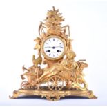 A late 19th century French gilt metal figural mantel clock by Henri Marc of Paris the white enamel