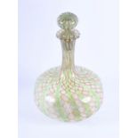 A hand blown Venetian glass decanter of squat bulbous form with pinched bowl, drawn neck, flared rim