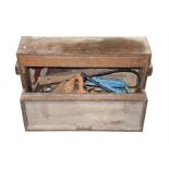 An early 20th century rectangular upright wooden tool chest with fitted drawer, and drop-hatch door,