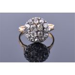 An 18ct yellow gold and diamond ring the circular cluster mount set with old cut diamonds of