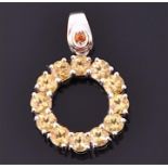 A 9ct white gold and citrine halo pendant the openwork mount set with twelve round cut bright yellow