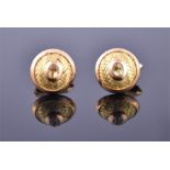 A pair of 18ct yellow gold cufflinks of circular domed form, with plaited gold ribbon decoration and
