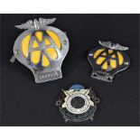 Three 20th Century vehicle radiator badges A Kuwaiti Automobile & Touring club example, 7.3 cm high.