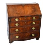 A George III mahogany bureau of small proportions the crossbanded fall front with fitted interior,