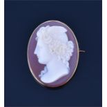 A fine quality Victorian yellow gold mounted oval cameo brooch depicting a profile of a Classical
