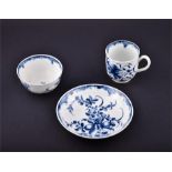 An 18th Century blue and white Worcester footed tea bowl and saucer.  Hand painted with floral