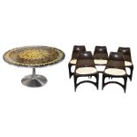 A 20th Century round dining table by Poul Cadovius and a set of five Steen Ostergaard chairs the