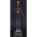 A large crystal glass and brass Corinthian column electric table lamp the tapered faceted stem
