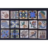 A collection of 15 assorted miniature Gothic tiles glazed and decorated with faces and patterns, 7 x