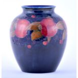 A large William Moorcroft Pomegranate vase of tapering baluster form with cylindrical rim. Signature