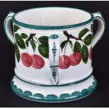 A late 19th century Wemyss tyg decorated with cherries the three handles, base and rim with green