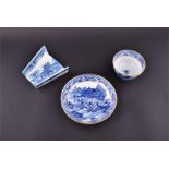A transfer printed blue and white asparagus dish together with a blue and white gilt edged tea