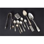 A collection of mixed silver cutlery together with a vesta case, and a silver clip, to include a a