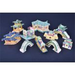 A collection of ten miniature Chinese ceramic temple models with colourful glazes and numbered to
