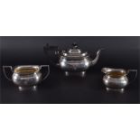 A George V three-piece silver tea set Birmingham, 1930 by William Adams Ltd. Comprising teapot