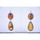 An impressive pair of 18ct white gold, white sapphire, and amber drop earrings each with an oval