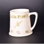 A William Moorcroft for Liberty 'Queen Mary and George V' commemorative mug the body decorated
