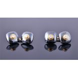 A pair of Mappin & Webb 18ct yellow gold, diamond, and hematite cufflinks each with two cushion-