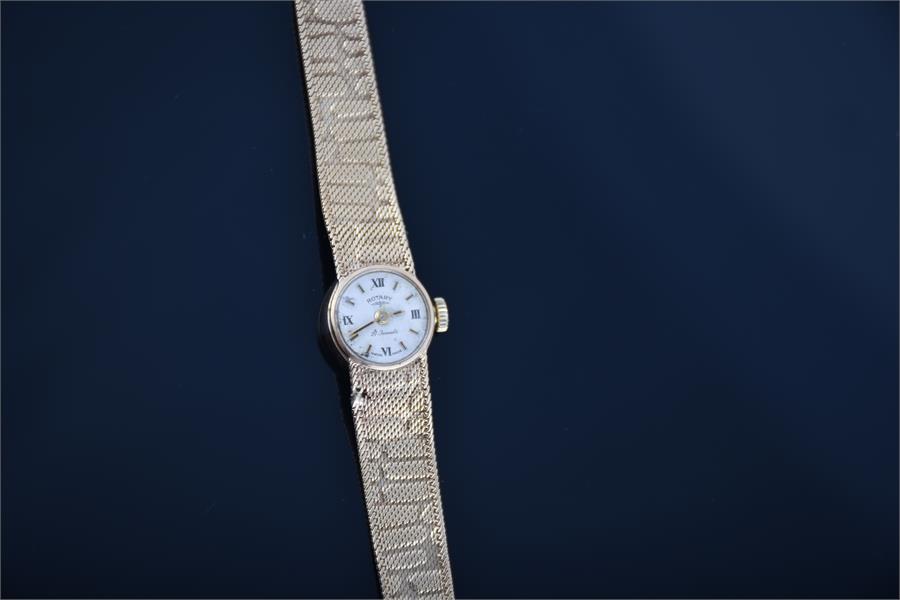 A ladies 9ct gold Rotary wristwatch with mechanical hand wound movement, on a bark effect mesh - Image 2 of 3