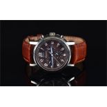 A Gautier stainless steel chronograph wrist watch the brown engine turned dial with date aperture