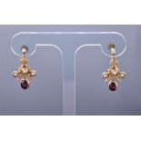 A pair of 9ct yellow gold, pearl, and garnet drop earrings  in the Bohemian style, the