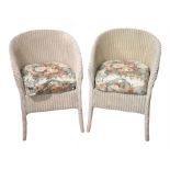 A pair of Lloyd loom tub chairs with white-painted frames, and floral cushions, height 68cm