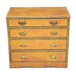 A mid 20th century leather-bound brass-studded chest the four graduated drawers with brass