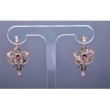 A pair of Edwardian 9ct yellow gold openwork garnet drop earrings in the Art Nouveau style, the