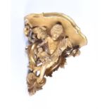 A large 19th century carved gilt wood and gesso cherub corner wall shelf the cherub surrounded by