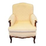 A Continental upholstered armchair with carved fruitwood frame, the back, sides and seat upholstered