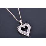 A 9ct white gold and diamond heart-shaped pendant the openwork mount set with baguette and round cut