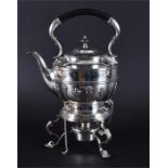 A silver plated spirit kettle on stand with black ebonised handle, ribbed with lower half decoration