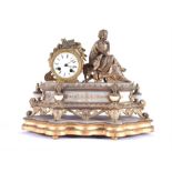 A 19th Century French ormolu mantel clock the circular white enamelled dial with black Roman