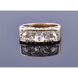A 9ct yellow gold and amblygonite ring the rectangular openwork mount set with four oval cut lemon
