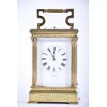 A Victorian repeating carriage clock  the white enamel dial with Roman numerals and signed