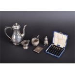 A collection of assorted silver items to include a 1916 Harrods coffee pot, six boxed cocktail
