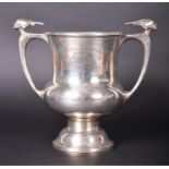 A large silver trophy cup London 1935, by Edward Barnard & Sons Ltd., a stylised head in profile