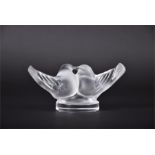 A Lalique frosted glass model of two lovebirds on a circular base, signed Lalique France. 6.5 cm
