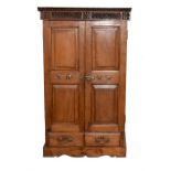 An Eastern hardwood cabinet, with panelled hinged doors and shelved interior.