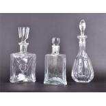 Two mid-20th century cut glass decanters together with a Bohemia lead crystal decanter, with Bohemia