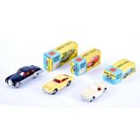 A group of three Corgi Toys die cast toy cars in boxes comprising: 218 Aston Martin DB4 in yellow,