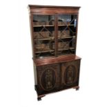 A 19th century mahogany glazed bookcase the top with a pair of astragal glazed doors enclosing