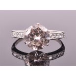 A large solitaire diamond ring set with a round brilliant cut diamond of approximately 2.40
