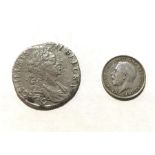 A 1697 William III silver shilling Chester, together with a 1918 silver threepenny bit. (2)