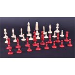 An English 19th century stained bone chess set the kings with carved column and circular bases.