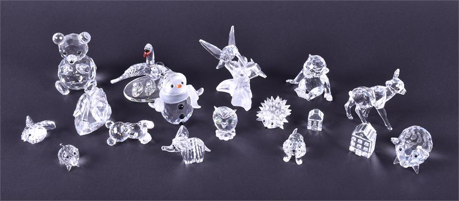 A selection of small Swarovski Crystal figurines to include a pig and piglet, two swans, a deer,